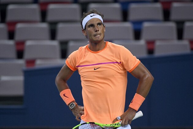 Rafael Nadal of Spain reacts after losing a point against Viktor Troicki of Serbia during their men's singles match at the Shanghai Masters tennis tournament in Shanghai on October 12, 2016. / AFP / WANG ZHAO        (Photo credit should read WANG ZHAO/AFP/Getty Images)