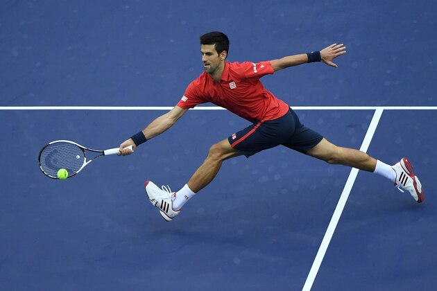 Novak Djokovic of Serbia hits a return against Alexander Zverev of Germany during their men's singles match at the Shanghai Masters tennis tournament in Shanghai on October 14, 2016. / AFP / WANG ZHAO        (Photo credit should read WANG ZHAO/AFP/Getty Images)