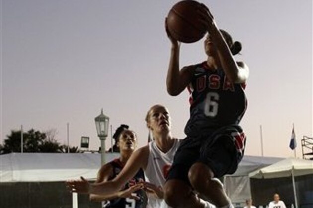 Bria Hartley of USA shoots as  Karen Heinen of Netherlands and Skylar Diggins of USA look on during a basketball game for the  3X3 World basketball Championship in front of Zappeion hall in Athens, Saturday Aug. 25, 2012.  (AP Photo/Kostas Tsironis)
