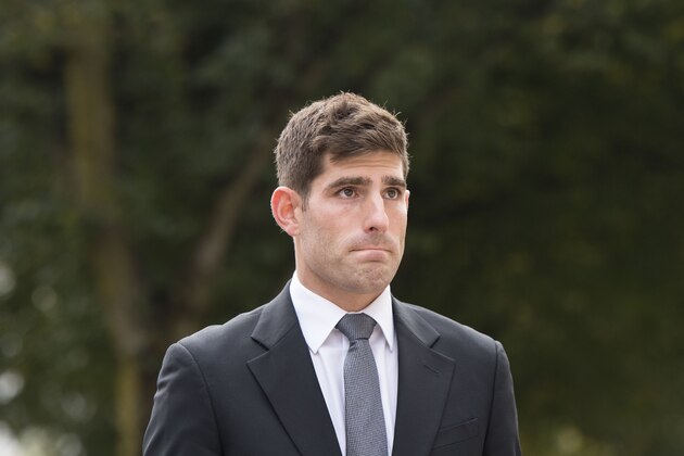 CARDIFF, WALES - OCTOBER 11:  Chesterfield F.C football player Ched Evans arrives for retrial on rape charges at Cardiff Crown Court on October 11, 2016 in Cardiff, Wales. The former Wales striker was jailed in 2012 for raping a 19-year-old woman, but had his conviction quashed by the Court of Appeal in April.  (Photo by Matthew Horwood/Getty Images)