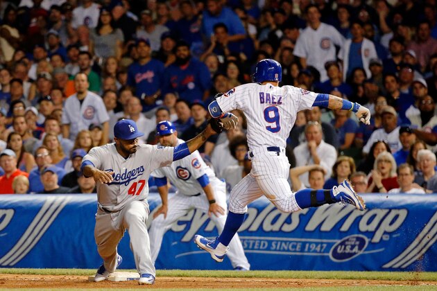 CHICAGO, IL - JUNE 01:  Howie Kendrick #47 of the Los Angeles Dodgers forces out Javier Baez #9 of the Chicago Cubs during the seventh inning at Wrigley Field on June 1, 2016 in Chicago, Illinois.  (Photo by Jon Durr/Getty Images)