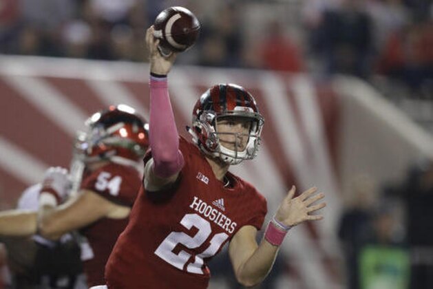 FILE - In this Oct. 1, 2016, file photo, Indiana quarterback Richard Lagow (21) throws during the team's NCAA college football game against Michigan State in Bloomington, Ind. Nebraska senior Tommy Armstrong Jr. and Indiana junior Richard Lagow could put on quite an air show Saturday. They’re ranked second and third in the Big Ten in passing efficiency with nearly identical numbers. (AP Photo/Darron Cummings, File)