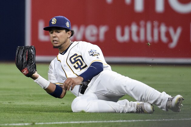 SAN DIEGO, CALIFORNIA - SEPTEMBER 19:  Jon Jay #24 of the San Diego Padres makes a sliding catch on a ball hit by Brandon Drury #27 of the Arizona Diamondbacks during the sixth inning of a baseball game at PETCO Park on September 19, 2016 in San Diego, California.  (Photo by Denis Poroy/Getty Images)