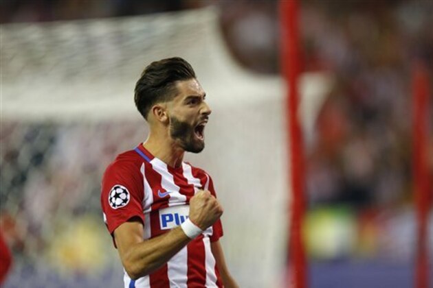 Atletico's Yannick Carrasco celebrates scoring the opening goal during the Champions League group D soccer match between Atletico Madrid and FC Bayern Munich at the Vicente Calderon stadium in Madrid, Spain, Wednesday, Sept. 28, 2016 . (AP Photo/Daniel Ochoa de Olza)