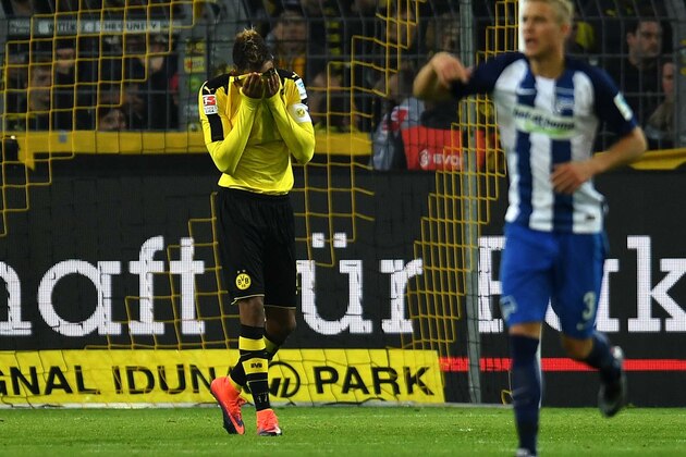 Dortmund's Gabonese striker Pierre-Emerick Aubameyang react during the German first division Bundesliga football match between BVB Borussia Dortmund and Hertha BSC Berlin in Dortmund, western Germany on October 14, 2016. / AFP / PATRIK STOLLARZ / RESTRICTIONS: DURING MATCH TIME: DFL RULES TO LIMIT THE ONLINE USAGE TO 15 PICTURES PER MATCH AND FORBID IMAGE SEQUENCES TO SIMULATE VIDEO. == RESTRICTED TO EDITORIAL USE == FOR FURTHER QUERIES PLEASE CONTACT DFL DIRECTLY AT + 49 69 650050
        (Photo credit should read PATRIK STOLLARZ/AFP/Getty Images)