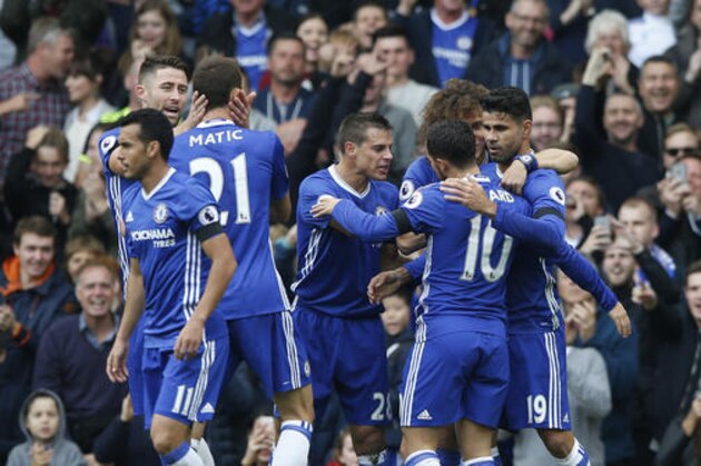 Chelsea's Diego Costa, right, celebrates with teammates after he scores the opening goal of the game during the English Premier League soccer match between Chelsea and Leicester City, at Stamford Bridge stadium in London, Saturday, Oct. 15, 2016. (AP Photo/Alastair Grant)