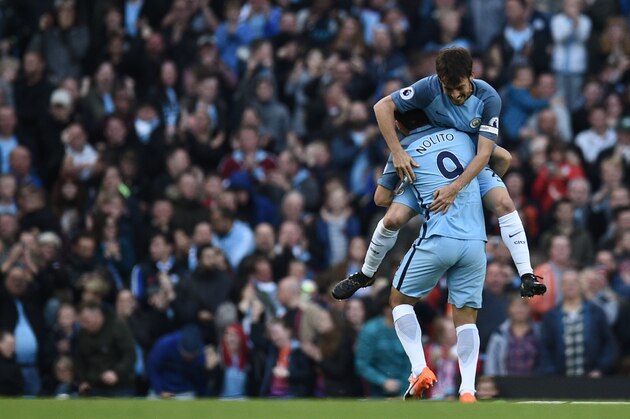 Manchester City's Spanish midfielder Nolito (R) celebrates with Manchester City's Spanish midfielder David Silva after scoring during the English Premier League football match between Manchester City and Everton at the Etihad Stadium in Manchester, north west England, on October 15, 2016. / AFP / OLI SCARFF / RESTRICTED TO EDITORIAL USE. No use with unauthorized audio, video, data, fixture lists, club/league logos or 'live' services. Online in-match use limited to 75 images, no video emulation. No use in betting, games or single club/league/player publications.  /         (Photo credit should read OLI SCARFF/AFP/Getty Images)