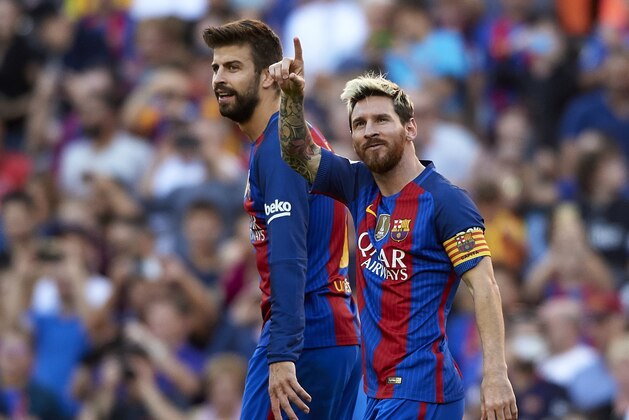 BARCELONA, SPAIN - OCTOBER 15:  Lionel Messi of FC Barcelona celebrates scoring his team's fourth goal with his teammate Gerard Pique during the La Liga match between FC Barcelona and RC Deportivo de La Coruna at Camp Nou stadium on October 15, 2016 in Barcelona, Spain.  (Photo by Manuel Queimadelos Alonso/Getty Images)