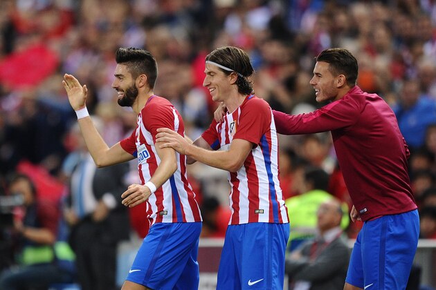 MADRID, SPAIN - OCTOBER 15:  Yannick Carrasco of Club Atletico de Madrid celebrates with Felipe Luis after scoring his 3rd goal during the La Liga match between Club Atletico de Madrid and Granada CF at Vicente Calderon Stadium on October 15, 2016 in Madrid, Spain.  (Photo by Denis Doyle/Getty Images)