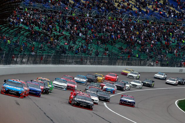 KANSAS CITY, KS - OCTOBER 15:  Kyle Busch, driver of the #18 NOS Energy Drink Toyota, and Erik Jones, driver of the #20 Reser's Main Street Bistro Toyota, lead the field to start the NASCAR XFINITY Series Kansas Lottery 300 at Kansas Speedway on October 15, 2016 in Kansas City, Kansas.  (Photo by Matt Sullivan/Getty Images)