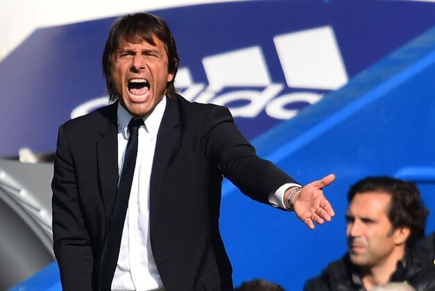 Chelsea's Italian head coach Antonio Conte gestures on the touchline during the English Premier League football match between Chelsea and Leicester City at Stamford Bridge in London on October 15, 2016. / AFP / Glyn KIRK / RESTRICTED TO EDITORIAL USE. No use with unauthorized audio, video, data, fixture lists, club/league logos or 'live' services. Online in-match use limited to 75 images, no video emulation. No use in betting, games or single club/league/player publications.  /         (Photo credit should read GLYN KIRK/AFP/Getty Images)