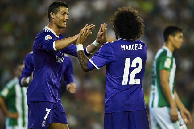 SEVILLE, SPAIN - OCTOBER 15:  Marcelo (R) and Cristiano Ronaldo of Real Madrid CF celebrates after scoring during the match between Real Betis Balompie and Real Madrid CF as part of La Liga at Benito Villamrin stadium October 15, 2016 in Seville, Spain.  (Photo by Aitor Alcalde/Getty Images)
