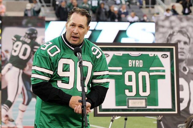 EAST RUTHERFORD, NJ - OCTOBER 28:  (NEW YORK DAILIES OUT)  Former New York Jet Dennis Byrd speaks to the crowd during a ceremony retiring his number 90 during halftime of a game against the Miami Dolphins at MetLife Stadium on October 28, 2012 in East Rutherford, New Jersey. The Dolphins defeated the Jets 30-9.  (Photo by Jim McIsaac/Getty Images)