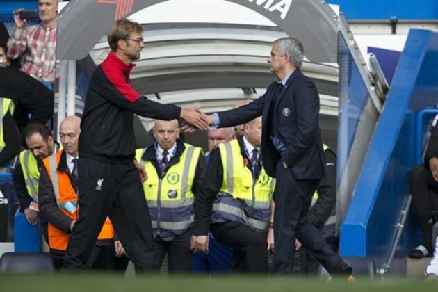 Chelsea's head coach Jose Mourinho, right, shakes hands with Liverpool's head coach Juergen Klopp after the final whistle of the English Premier League soccer match between Chelsea and Liverpool at Stamford Bridge stadium in London, Saturday, Oct. 31, 2015. Chelsea were defeated 3-1. (AP Photo/Matt Dunham)