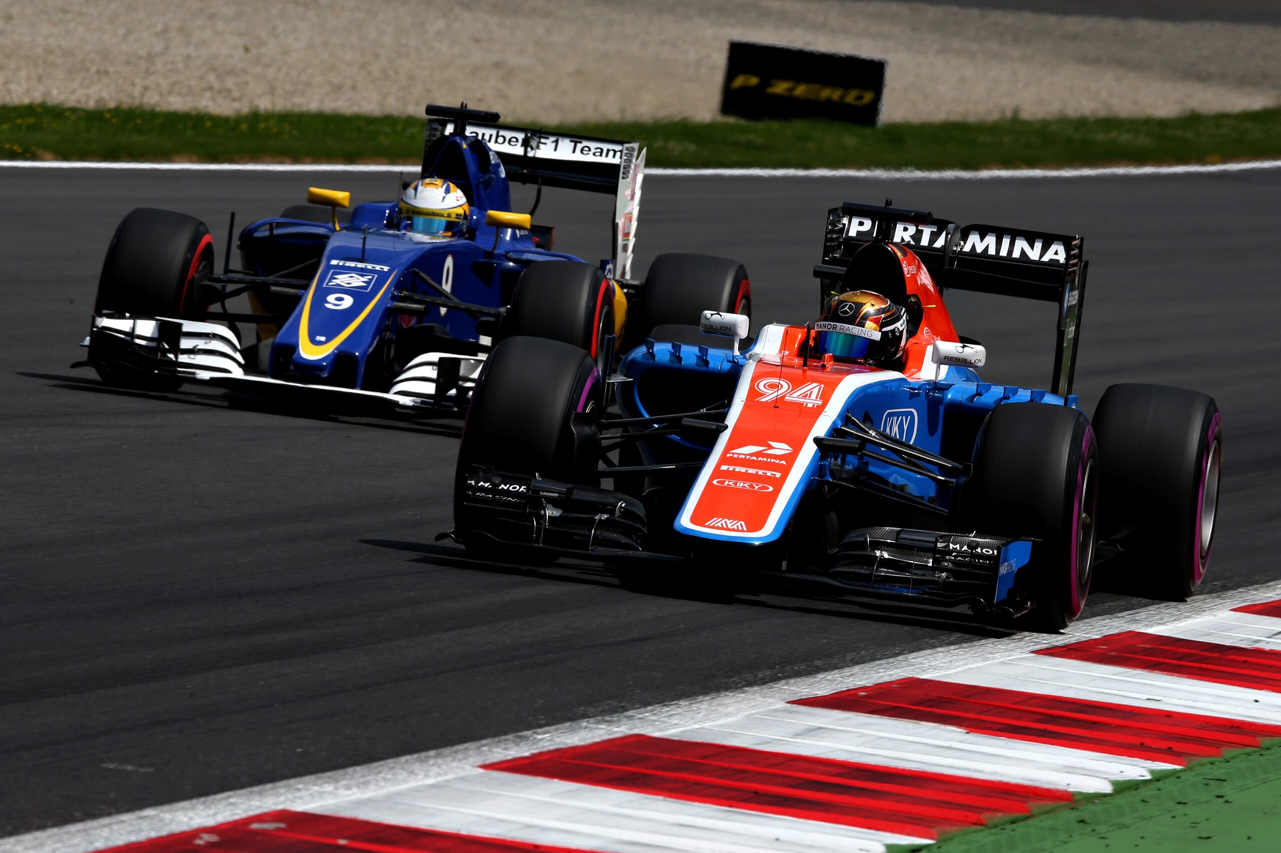 SPIELBERG, AUSTRIA - JULY 02: Pascal Wehrlein of Germany driving the (94) Manor Racing MRT-Mercedes MRT05 Mercedes PU106C Hybrid turbo on track ahead of Marcus Ericsson of Sweden driving the (9) Sauber F1 Team Sauber C35 Ferrari 059/5 turbo during qualifying for the Formula One Grand Prix of Austria at Red Bull Ring on July 2, 2016 in Spielberg, Austria.  (Photo by Charles Coates/Getty Images)
