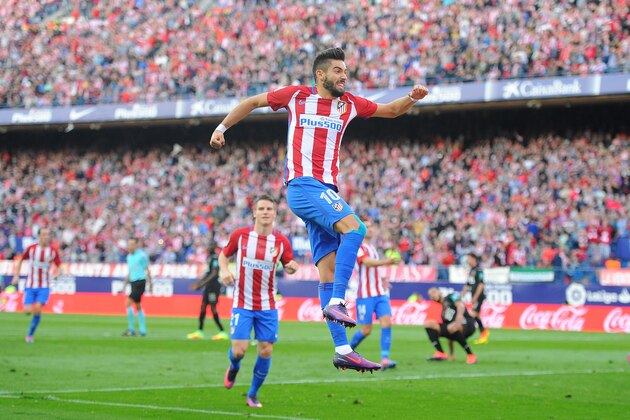 MADRID, SPAIN - OCTOBER 15:  Yannick Carrasco of Club Atletico de Madrid celebrates after scoring his team's opning goal during the La Liga match between Club Atletico de Madrid and Granada CF at Vicente Calderon Stadium on October 15, 2016 in Madrid, Spain.  (Photo by Denis Doyle/Getty Images)