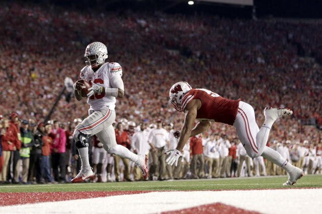 MADISON, WI - OCTOBER 15: J.T. Barrett #16 of the Ohio State Buckeyes runs the football in for a touchdown during the fourth quarter against the Wisconsin Badgers at Camp Randall Stadium on October 15, 2016 in Madison, Wisconsin. (Photo by Mike McGinnis/Getty Images)