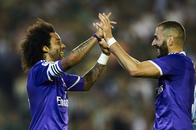SEVILLE, SPAIN - OCTOBER 15:  Marcelo of Real Madrid CF (L) celebrates after scoring with Karim Benzema of Real Madrid CF (R) during the match between Real Betis Balompie and Real Madrid CF as part of La Liga at Benito Villamrin stadium October 15, 2016 in Seville, Spain.  (Photo by Aitor Alcalde/Getty Images)