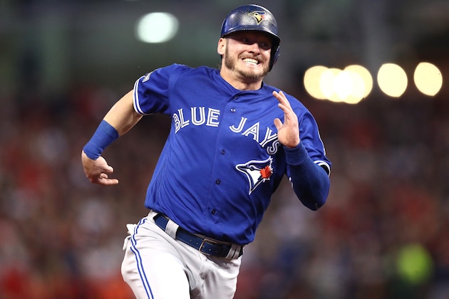 CLEVELAND, OH - OCTOBER 14:  Josh Donaldson #20 of the Toronto Blue Jays runs to third base after a double hit by Edwin Encarnacion #10 of the Toronto Blue Jays in the first inning against Corey Kluber #28 of the Cleveland Indians during game one of the American League Championship Series at Progressive Field on October 14, 2016 in Cleveland, Ohio.  (Photo by Maddie Meyer/Getty Images)