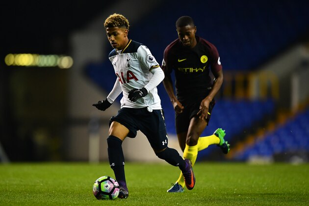 LONDON, ENGLAND - OCTOBER 14:  Marcus Edwards of Tottenham Hotspur breaks past Sadou Diallo of Manchester City during the Premier League 2 match between Tottenham Hotspur and Manchester City at White Hart Lane on October 14, 2016 in London, England. (Photo by Dan Mullan/Getty Images)