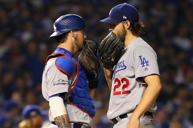 CHICAGO, IL - OCTOBER 16:  Yasmani Grandal #9 and Clayton Kershaw #22 of the Los Angeles Dodgers meet on the pitcher's mound in the fifth inning against the Chicago Cubs during game two of the National League Championship Series at Wrigley Field on October 16, 2016 in Chicago, Illinois.  (Photo by Jamie Squire/Getty Images)