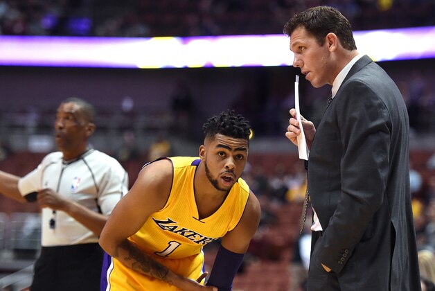 ANAHEIM, CA - OCTOBER 04:  D'Angelo Russell #1 of the Los Angeles Lakers listens to Luke Walton during a preseason game against the Sacramento Kings at Honda Center on October 4, 2016 in Anaheim, California.  NOTE TO USER: User expressly acknowledges and agrees that, by downloading and or using this photograph, User is consenting to the terms and conditions of the Getty Images License Agreement.  (Photo by Harry How/Getty Images)