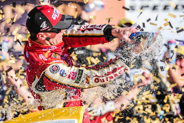 Oct 16, 2016; Kansas City, KS, USA; Sprint Cup Series driver Kevin Harvick (4) celebrates after winning the Hollywood Casino 400 at Kansas Speedway. Mandatory Credit: Jeffrey Becker-USA TODAY Sports