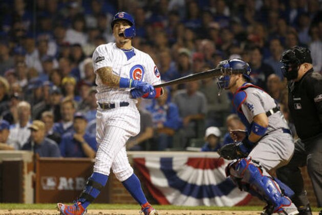Chicago Cubs second baseman Javier Baez (9) reacts after striking out during the second inning of Game 2 of the National League baseball championship series against the Los Angeles Dodgers Sunday, Oct. 16, 2016, in Chicago. (AP Photo/Nam Y. Huh)
