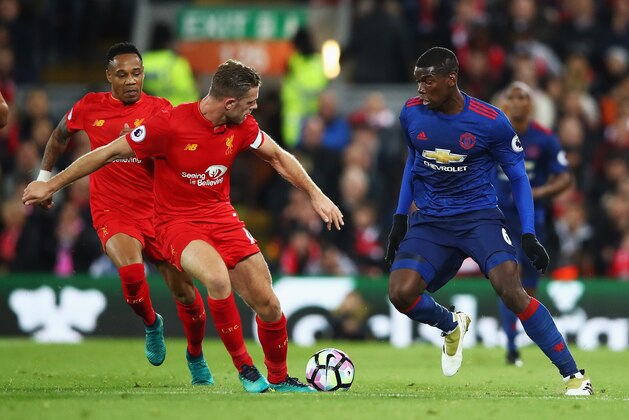 LIVERPOOL, ENGLAND - OCTOBER 17:  Paul Pogba of Manchester United takes on Jordan Henderson and Nathaniel Clyne of Liverpool during the Premier League match between Liverpool and Manchester United at Anfield on October 17, 2016 in Liverpool, England.  (Photo by Clive Brunskill/Getty Images)