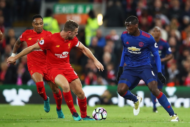 LIVERPOOL, ENGLAND - OCTOBER 17:  Paul Pogba of Manchester United takes on Jordan Henderson and Nathaniel Clyne of Liverpool during the Premier League match between Liverpool and Manchester United at Anfield on October 17, 2016 in Liverpool, England.  (Photo by Clive Brunskill/Getty Images)