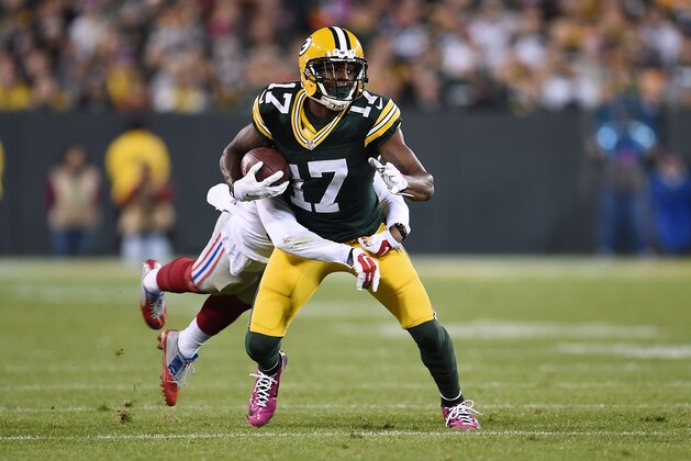 GREEN BAY, WI - OCTOBER 09:  Davante Adams #17 of the Green Bay Packers is brought down by Michael Hunter #39 of the New York Giants during the first half of a game at Lambeau Field on October 9, 2016 in Green Bay, Wisconsin.  (Photo by Stacy Revere/Getty Images)