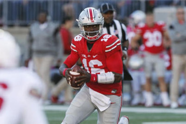FILE - In this Oct. 8, 2016, file photo, Ohio State quarterback J.T. Barrett runs the ball against Indiana during NCAA college football game in Columbus, Ohio. Barrett goes into Saturday's game against Wisconsin looking to strengthen his Heisman Trophy candidacy after last week’s poor passing performance against Indiana.  (AP Photo/Jay LaPrete, File)