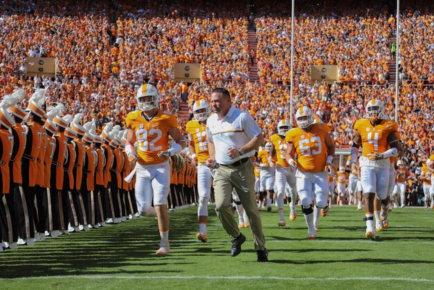 Oct 15, 2016; Knoxville, TN, USA; Tennessee Volunteers head coach Butch Jones runs on to the field before the game against the Alabama Crimson Tide at Neyland Stadium. Mandatory Credit: Randy Sartin-USA TODAY Sports