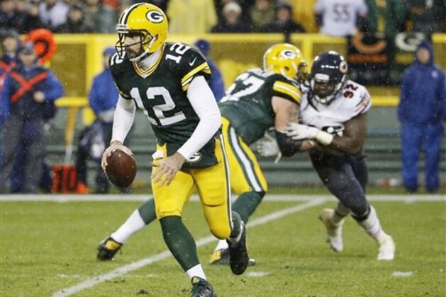 Green Bay Packers' Aaron Rodgers runs during the second half of an NFL football game against the Chicago Bears Thursday, Nov. 26, 2015, in Green Bay, Wis. (AP Photo/Morry Gash)