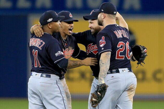 TORONTO, ON - OCTOBER 17:  Jose Ramirez #11, Francisco Lindor #12, Jason Kipnis #22 and Mike Napoli #26 of the Cleveland Indians celebrate after defeating the Toronto Blue Jays with a score of 4 to 2 in game three of the American League Championship Series at Rogers Centre on October 17, 2016 in Toronto, Canada.  (Photo by Vaughn Ridley/Getty Images)