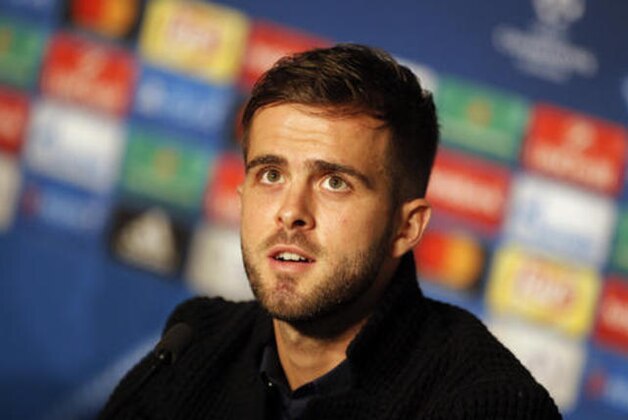 Juventus' Miralem Pjanic answers to journalists during a press conference in Decines, near Lyon, central France, Monday, Oct. 17, 2016. Juventus will face Lyon in a Champions League group H soccer match on Tuesday. (AP Photo/Laurent Cipriani)