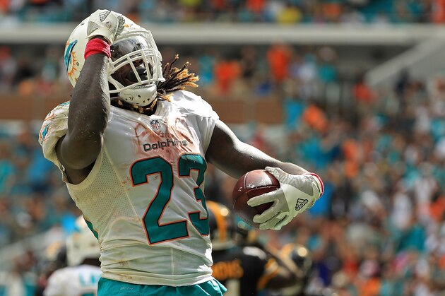 MIAMI GARDENS, FL - OCTOBER 16:  Jay Ajayi #23 of the Miami Dolphins celebrates a touchdown during a game against the Pittsburgh Steelers on October 16, 2016 in Miami Gardens, Florida.  (Photo by Mike Ehrmann/Getty Images)