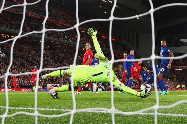 LIVERPOOL, ENGLAND - OCTOBER 17:  David De Gea of Manchester United saves from Emre Can of Liverpool during the Premier League match between Liverpool and Manchester United at Anfield on October 17, 2016 in Liverpool, England.  (Photo by Clive Brunskill/Getty Images)
