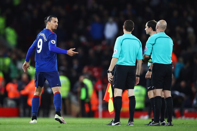 LIVERPOOL, ENGLAND - OCTOBER 17: Zlatan Ibrahimovic of Manchester United talks with referee Anthony Taylor and his assistants during the Premier League match between Liverpool and Manchester United at Anfield on October 17, 2016 in Liverpool, England.  (Photo by Clive Brunskill/Getty Images)