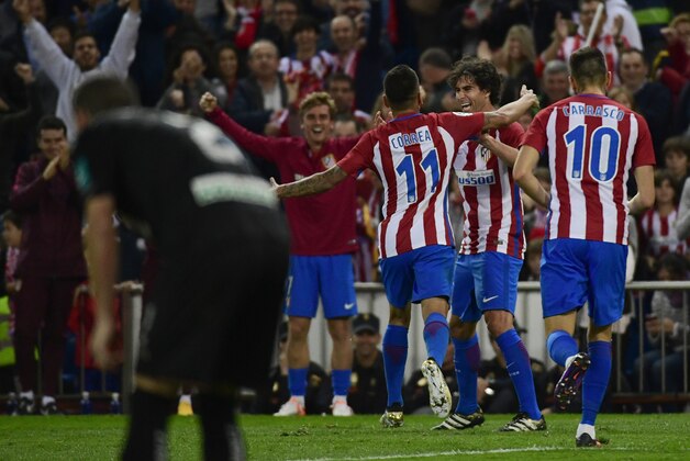 Atletico Madrid's Portuguese midfielder Tiago (2ndR) celebrates with teammates after scoring during the Spanish league football match Club Atletico de Madrid vs Granada FC at the Vicente Calderon stadium in Madrid on October 15, 2016.
Atletico won 7-1. / AFP / PIERRE-PHILIPPE MARCOU        (Photo credit should read PIERRE-PHILIPPE MARCOU/AFP/Getty Images)