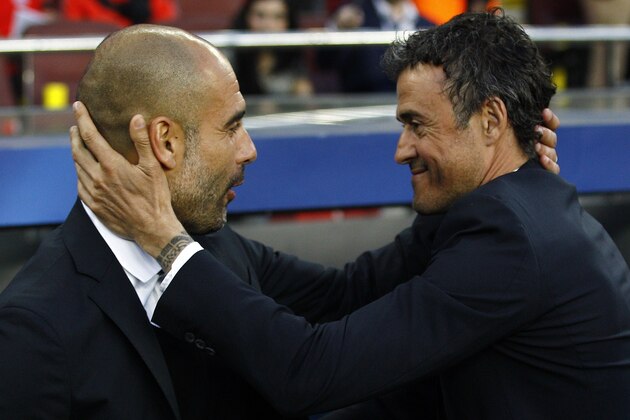 Bayern Munich's Spanish head coach Pep Guardiola (L) and Barcelona's coach Luis Enrique greet each other before the UEFA Champions League football match FC Barcelona vs FC Bayern Muenchen at the Camp Nou stadium in Barcelona on May 6, 2015.     AFP PHOTO/ QUIQUE GARCIA        (Photo credit should read QUIQUE GARCIA/AFP/Getty Images)