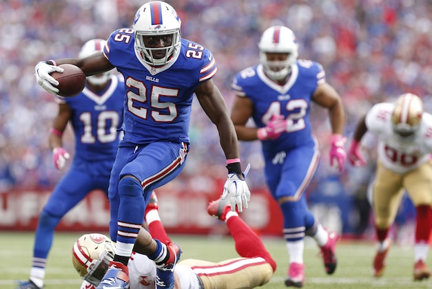 Oct 16, 2016; Orchard Park, NY, USA; Buffalo Bills running back LeSean McCoy (25) runs with the ball and breaks a tackle by San Francisco 49ers free safety Eric Reid (35) during the second half at New Era Field. Buffalo beat San Francisco 45-16. Mandatory Credit: Kevin Hoffman-USA TODAY Sports