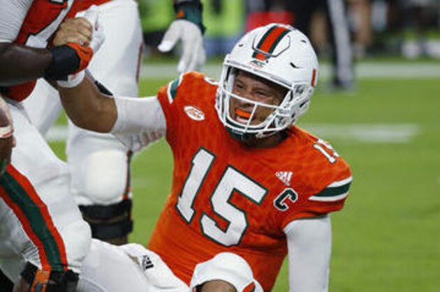 Miami Hurricanes quarterback Brad Kaaya (15) is helped to his feet after he was sacked during the first half of an NCAA college football game against the Florida State Seminoles, Saturday, Oct. 8, 2016, in Miami Gardens, Fla. (AP Photo/Wilfredo Lee)