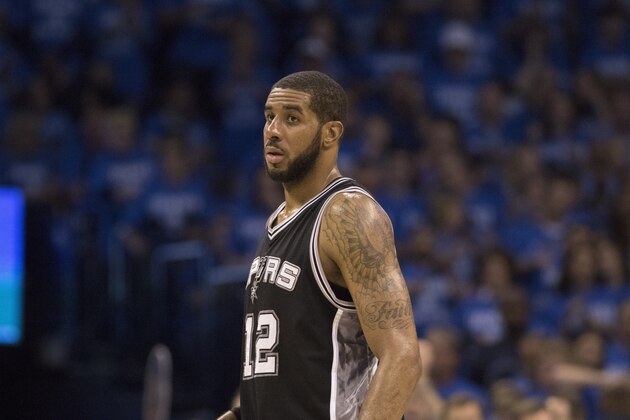 OKLAHOMA CITY, OK - MAY 12: LaMarcus Aldridge #12 of the San Antonio Spurs pauses as he watches game action against the Oklahoma City Thunder  during the second half of Game Six of the Western Conference Semifinals during the 2016 NBA Playoffs at the Chesapeake Energy Arena on May 12, 2016 in Oklahoma City, Oklahoma.   NOTE TO USER: User expressly acknowledges and agrees that, by downloading and or using this photograph, User is consenting to the terms and conditions of the Getty Images License Agreement. (Photo by J Pat Carter/Getty Images)