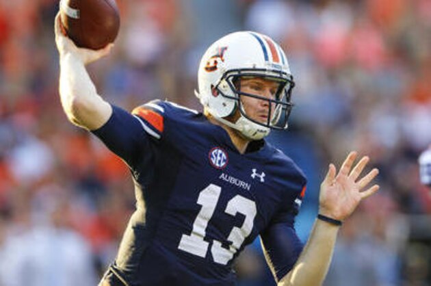 FILE - In this Sept. 24, 2016, file photo, Auburn quarterback Sean White (13) throws a pass against LSU during the first half of an NCAA college football game, in Auburn, Ala. The 21st-ranked Auburn Tigers have definitely shown signs of improvement in recent weeks, but Saturday's game with No. 17 Arkansas will give a better gauge of where they stand. (AP Photo/Butch Dill, File)