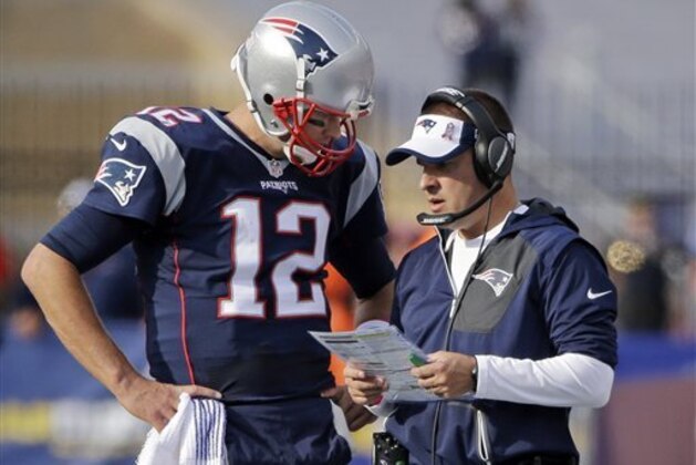 New England Patriots quarterback Tom Brady (12) and offensive coordinator Josh McDaniels huddle during the second half of an NFL football game against the Cincinnati Bengals, Sunday, Oct. 16, 2016, in Foxborough, Mass. (AP Photo/Elise Amendola)