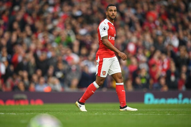 Arsenal's English midfielder Theo Walcott is pictured during the English Premier League football match between Arsenal and Swansea City at the Emirates Stadium in London on October 15, 2016. 
Arsenal won the game 3-2. / AFP / Justin TALLIS / RESTRICTED TO EDITORIAL USE. No use with unauthorized audio, video, data, fixture lists, club/league logos or 'live' services. Online in-match use limited to 75 images, no video emulation. No use in betting, games or single club/league/player publications.  /         (Photo credit should read JUSTIN TALLIS/AFP/Getty Images)