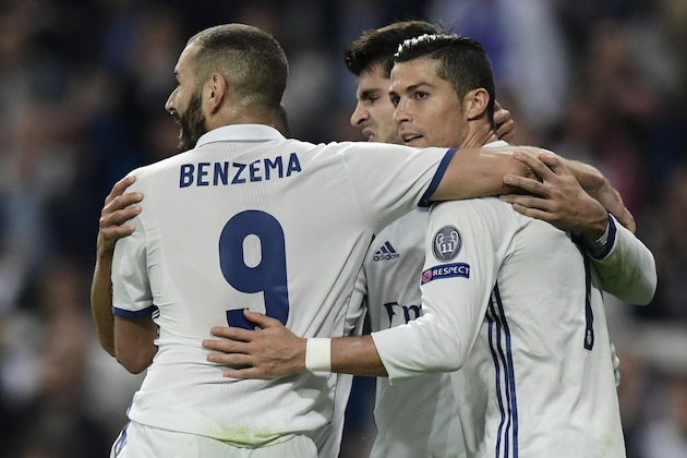 Real Madrid's forward Alvaro Morata (C), Real Madrid's Portuguese forward Cristiano Ronaldo (R) and Real Madrid's French forward Karim Benzema celebrate after scoring a goal during the UEFA Champions League football match Real Madrid CF vs Legia  Legia Warszawa at the Santiago Bernabeu stadium in Madrid on October 18, 2016. / AFP / JAVIER SORIANO        (Photo credit should read JAVIER SORIANO/AFP/Getty Images)