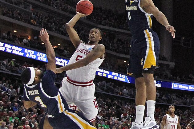 DES MOINES, IA - MARCH 17: Troy Williams #5 of the Indiana Hoosiers goes up for a shot between Greg Pryor #1 (L) and Chuck Ester #0 of the Chattanooga Mocs but is called for a charge during the first round of the 2016 NCAA Men's Basketball Tournament at Wells Fargo Arena on March 17, 2016 in Des Moines, Iowa. (Photo by Jonathan Daniel/Getty Images)