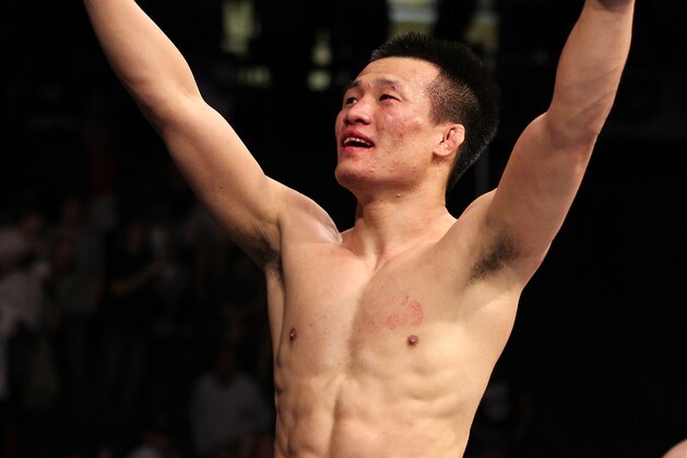 FAIRFAX, VA - MAY 15:  'The Korean Zombie' Chan Sung Jung reacts after defeating Dustin Poirier in a featherweight bout during the UFC on Fuel TV event at Patriot Center on May 15, 2012 in Fairfax, Virginia.  (Photo by Josh Hedges/Zuffa LLC/Zuffa LLC via Getty Images)